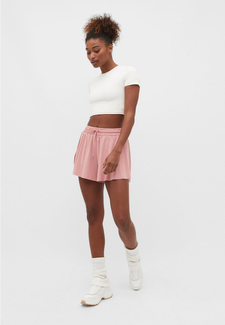 Stradivarius Fließende Sportshorts Puderrosa XS