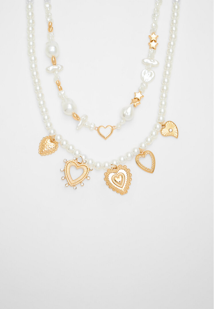 Stradivarius 2er-Set Halsketten mit Kunstperle und Multi-Herz Goldfarben OS
Stradivarius 2er-Set Halsketten mit Kunstperle und Multi-Herz Goldfarben OS