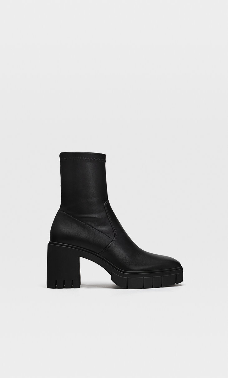 Track sole heeled ankle boots