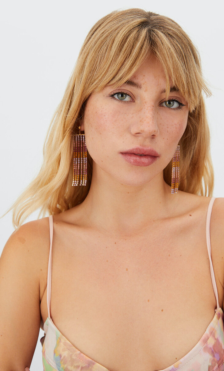Dangle earrings with coloured crystals.