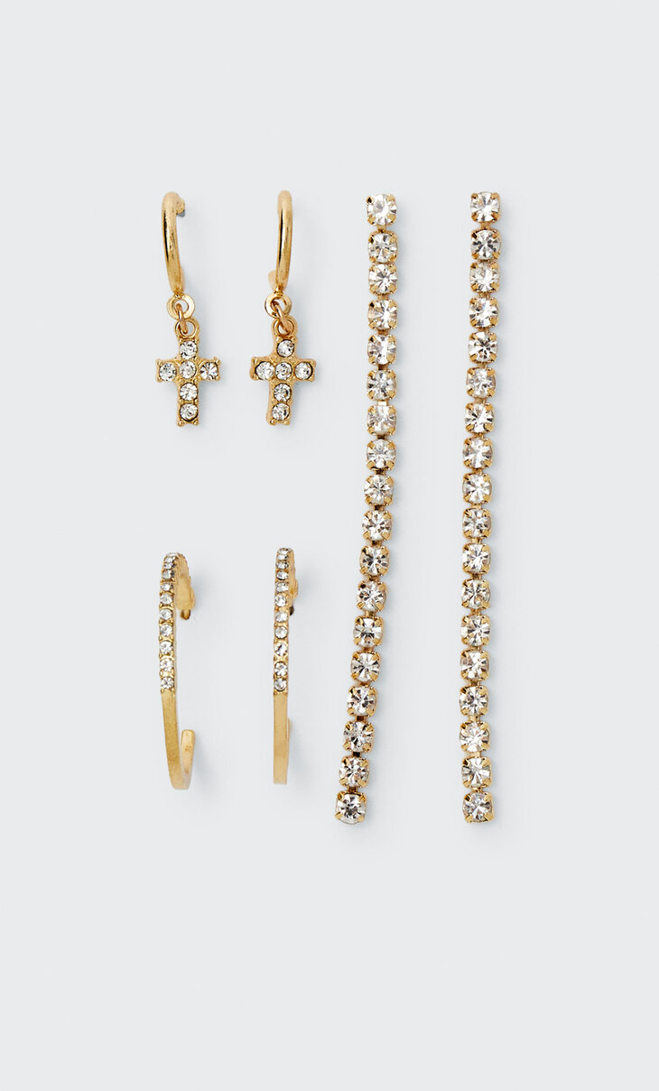 Set of 3 pairs of rhinestone dangle, hoop and cross earrings.