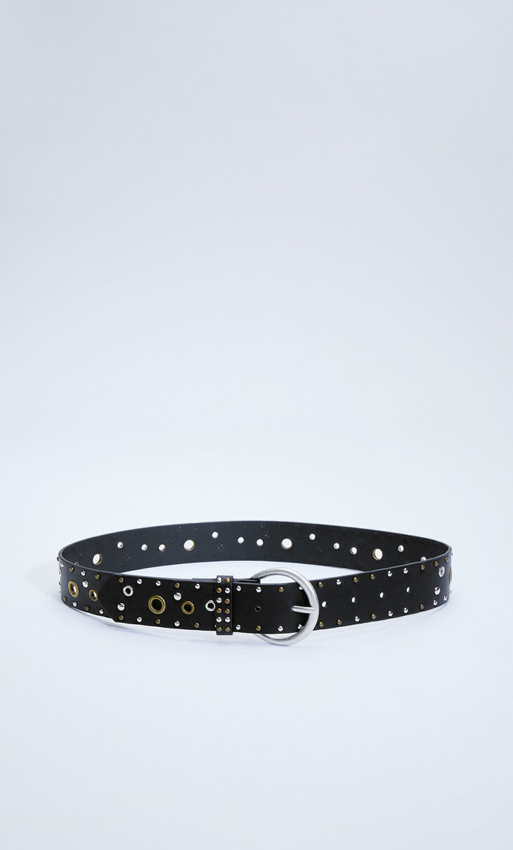 Belt with gold and silver eyelets