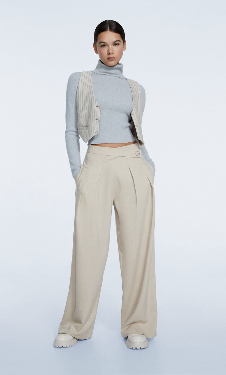 Smart trousers with crossover waistband