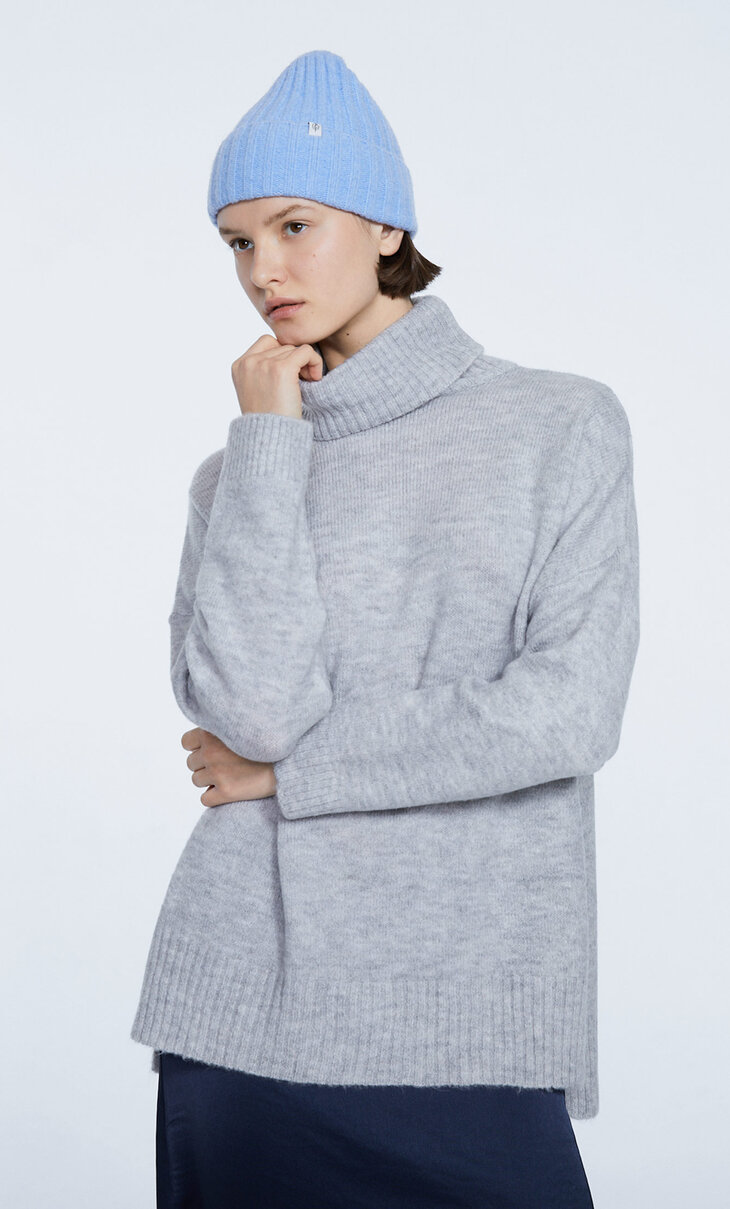 High-neck sweater with slits