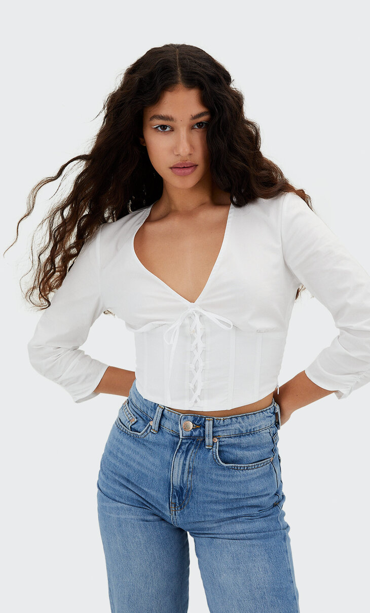 Corset blouse with knot detail