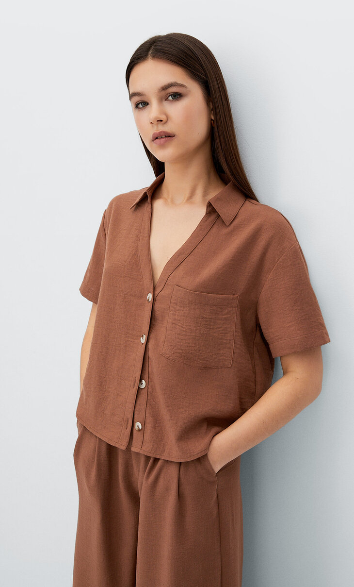 Rustieke blouse met lage halslijn