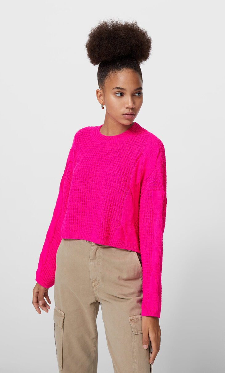 Neonfarbener Pullover mit Zopfmuster