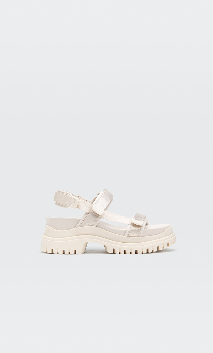 Flat sandals with white track soles
