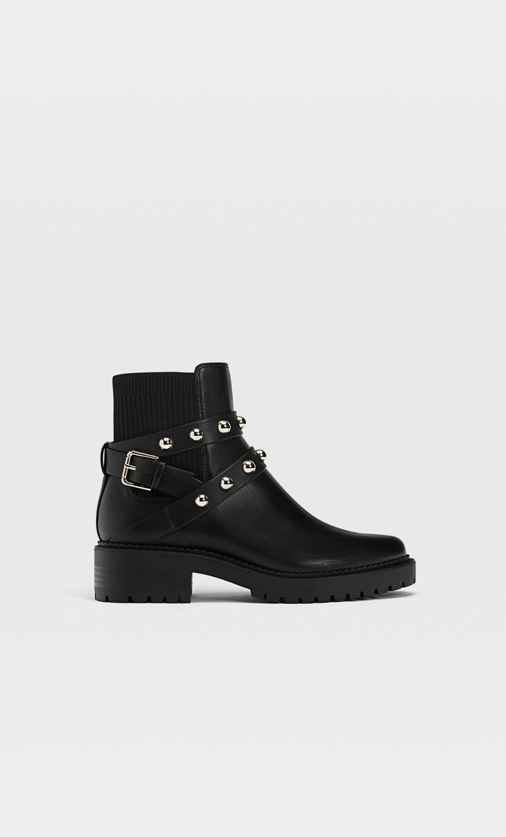 Flat black ankle boots with track soles