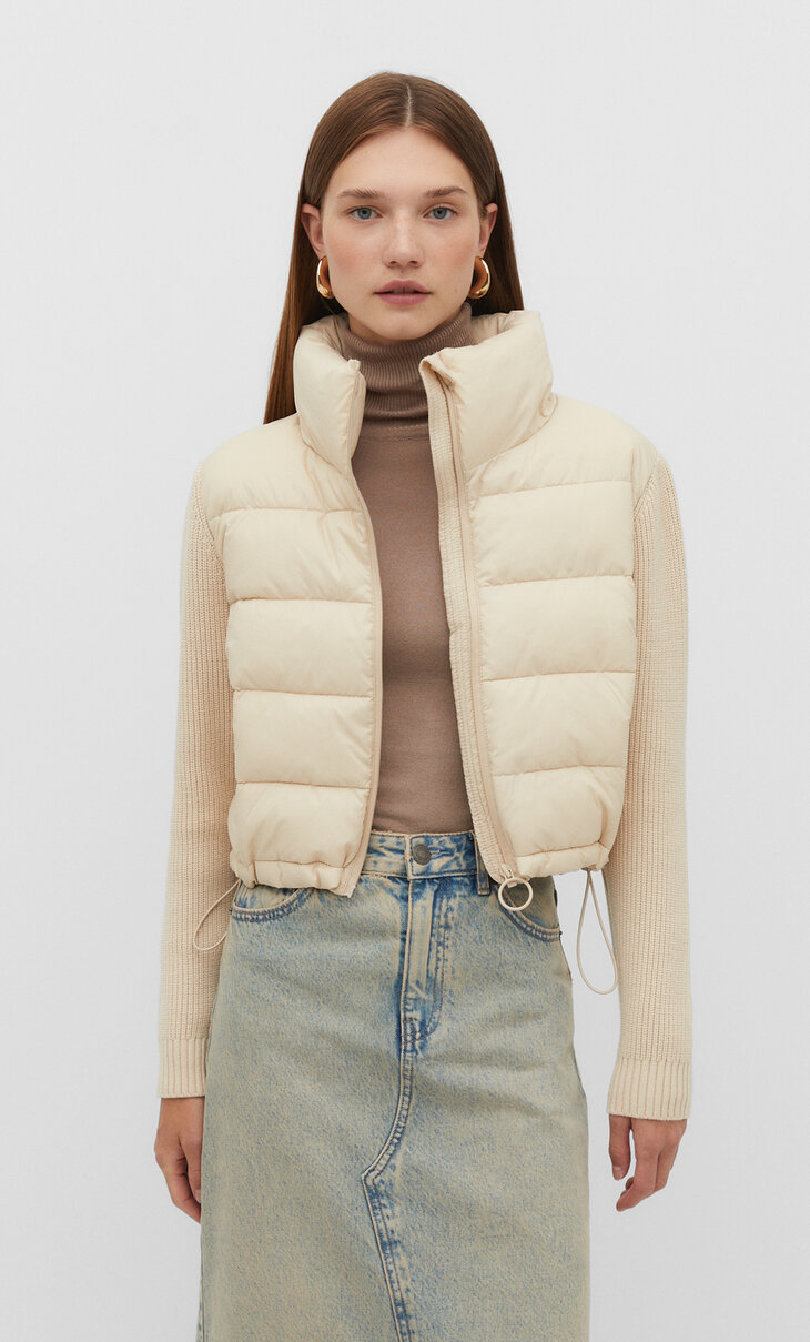Puffer jacket with chunky knit sleeves
