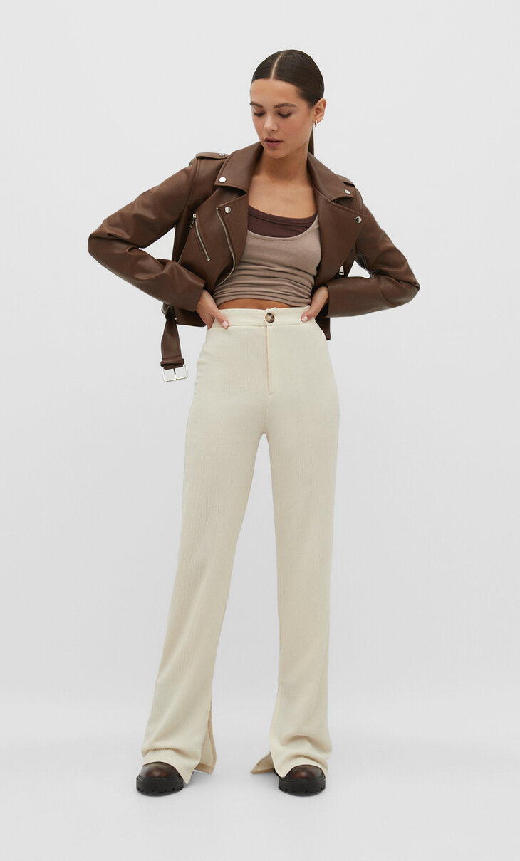 Rustic trousers with vent at the hem