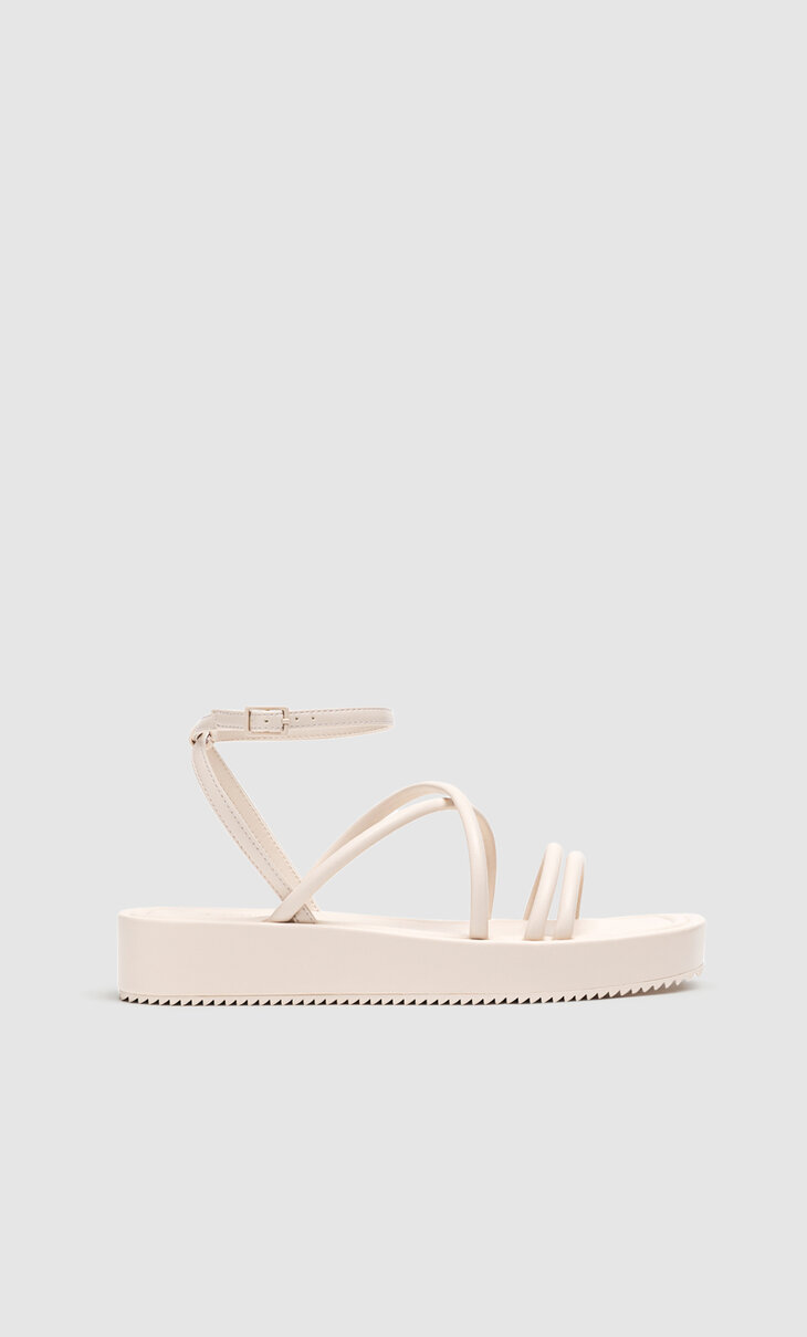Flat sandals with tied straps