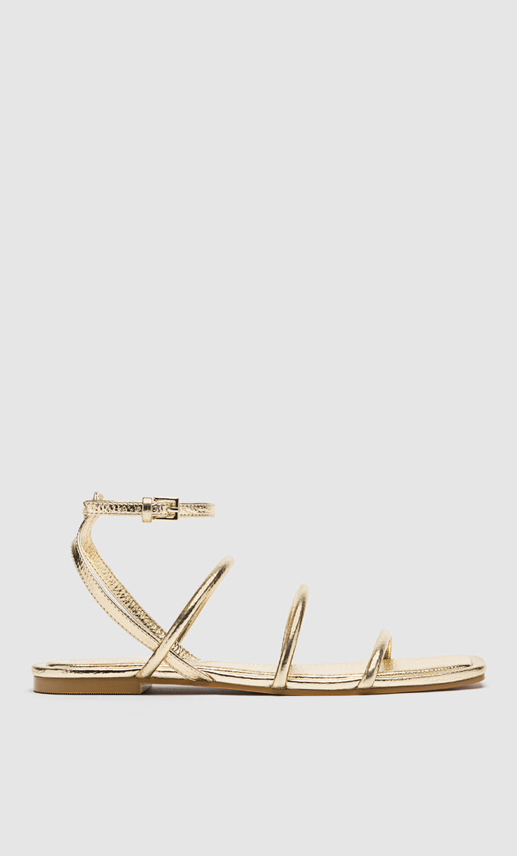 Flat sandals with tied straps