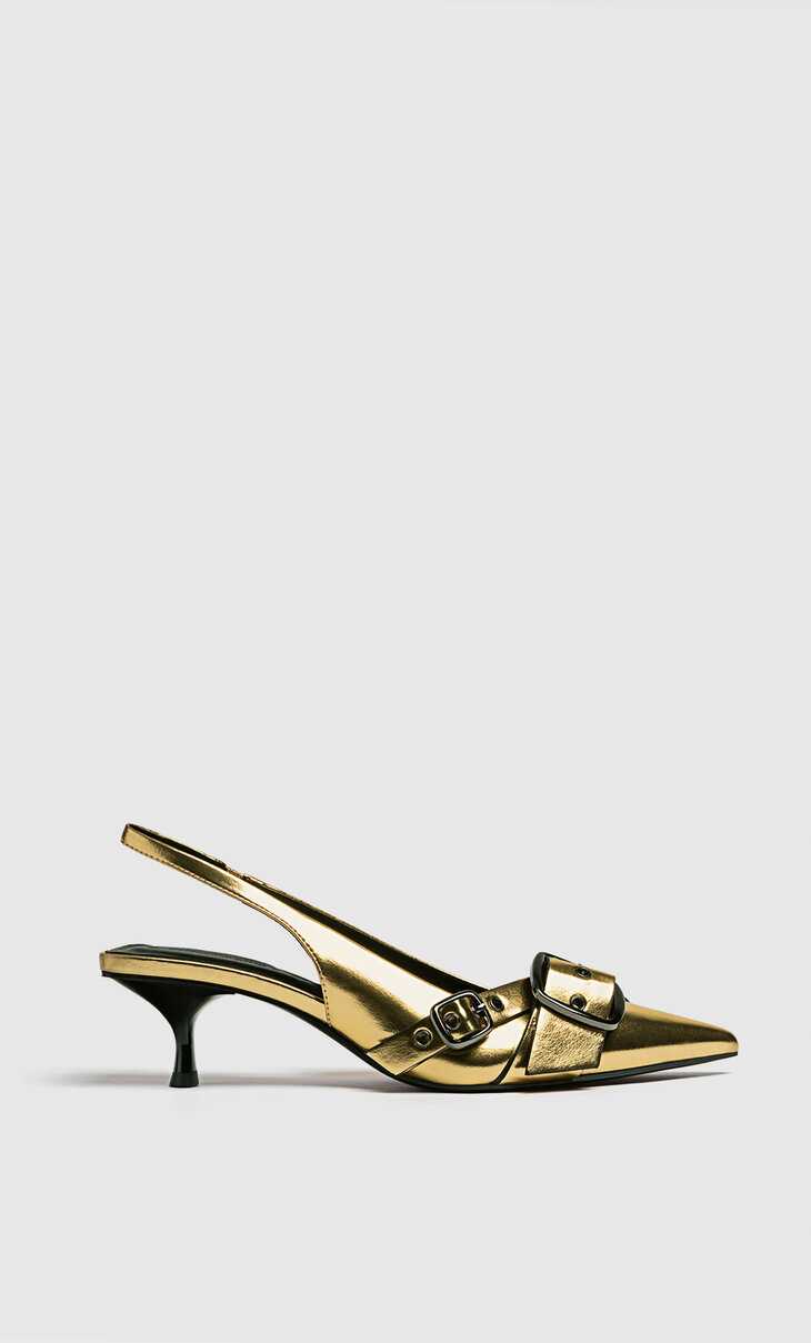 Gold heeled buckled shoes