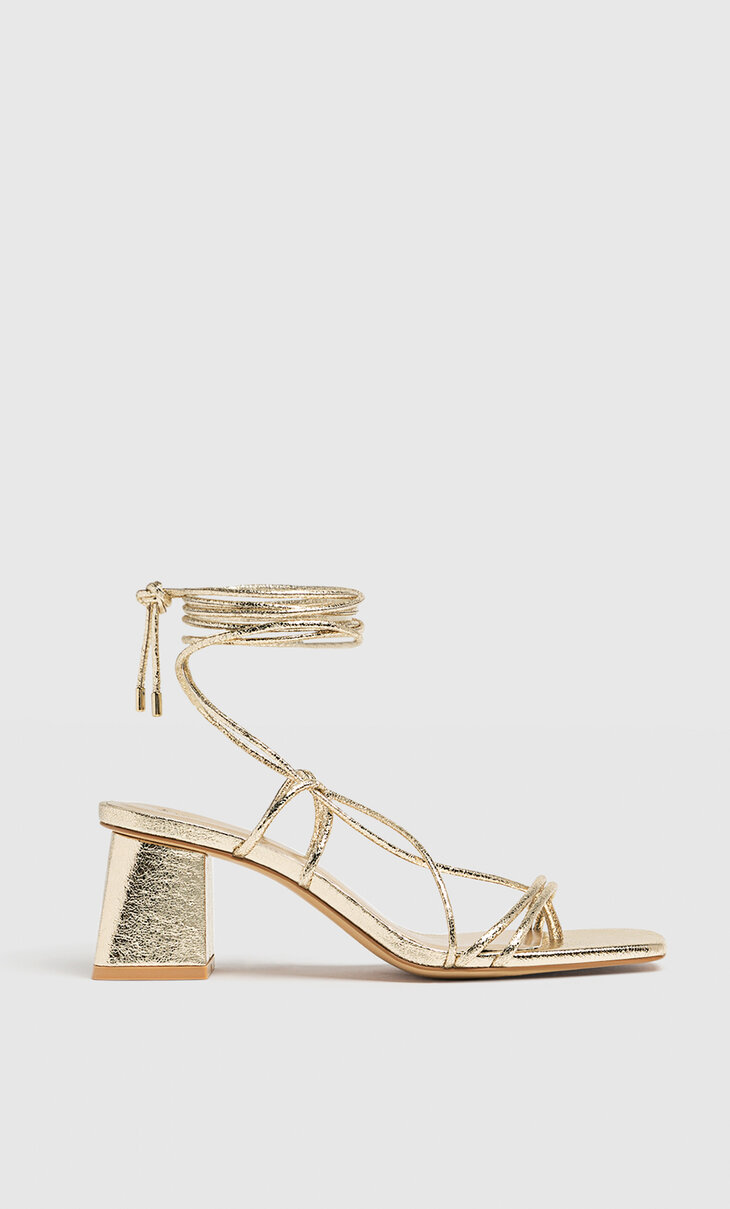 Golden high-heeled strappy sandals