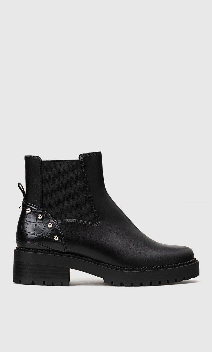 Flat studded ankle boots