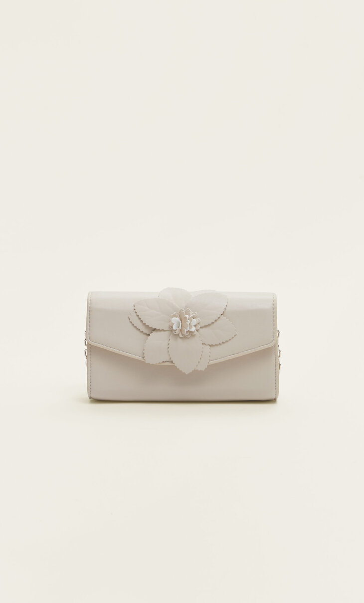 Faux leather mini clutch with flower detail