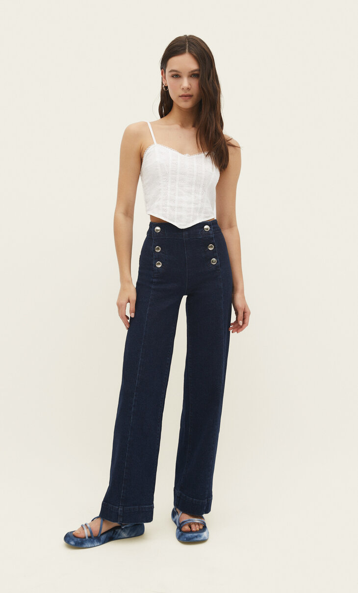 Full-length buttoned minimalist trousers