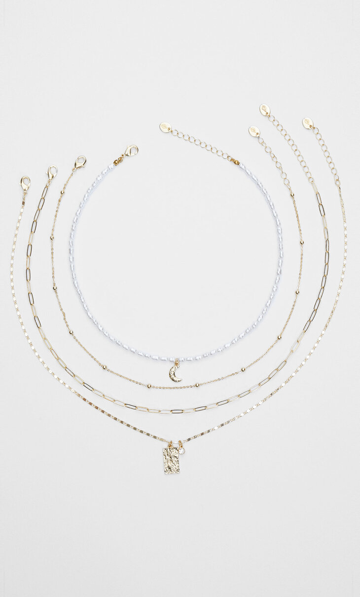 Set of 4 pearl bead and moon necklaces with medallion