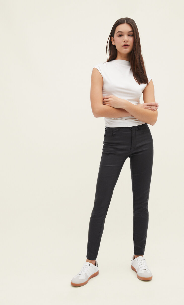 Coated low waist trousers