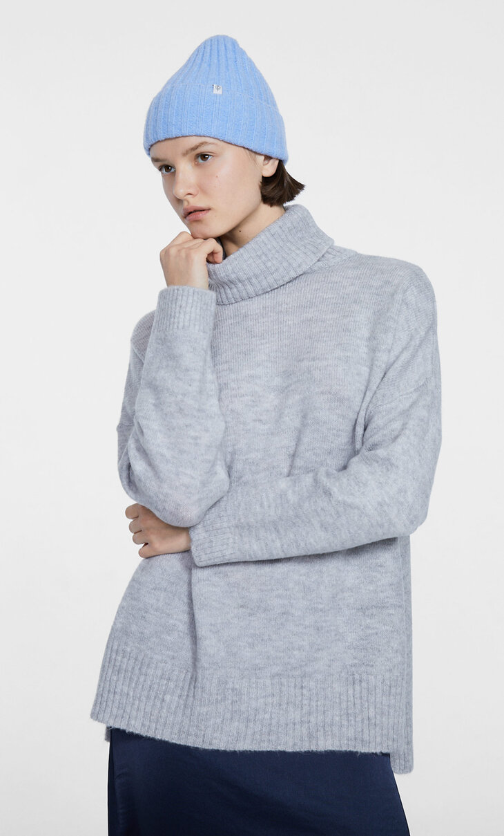 High-neck sweater with slits