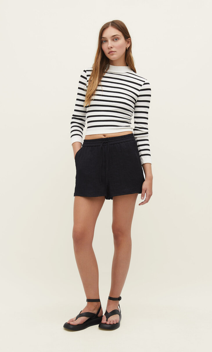 Seamless textured striped mock neck top