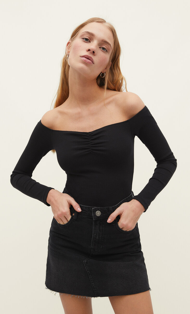 Bodysuit with a boat neck.