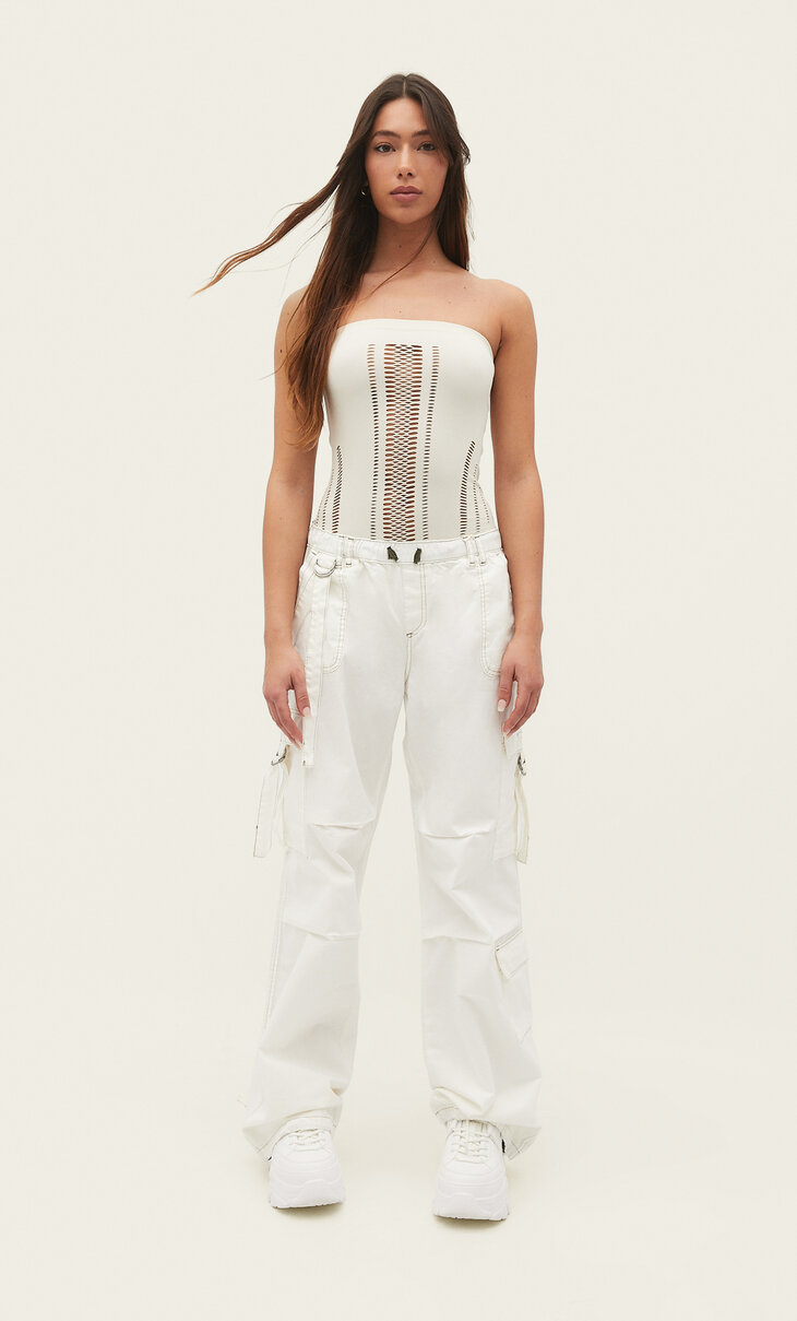 Bodysuit with perforations