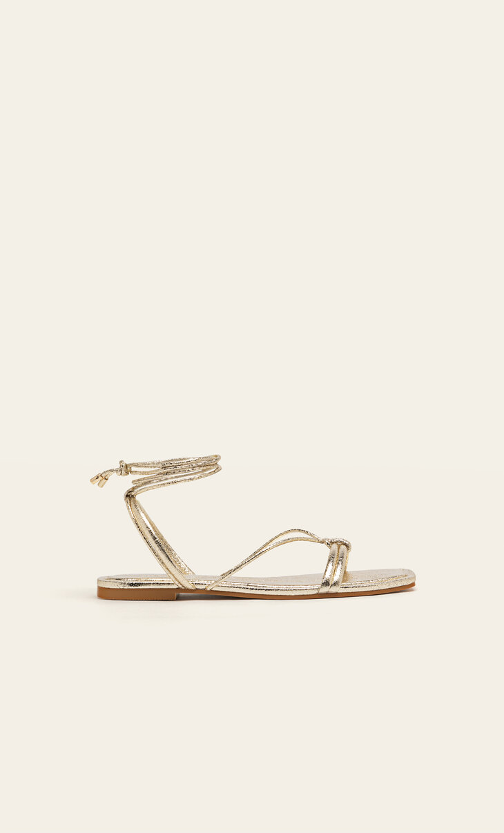 Flat gold strappy sandals