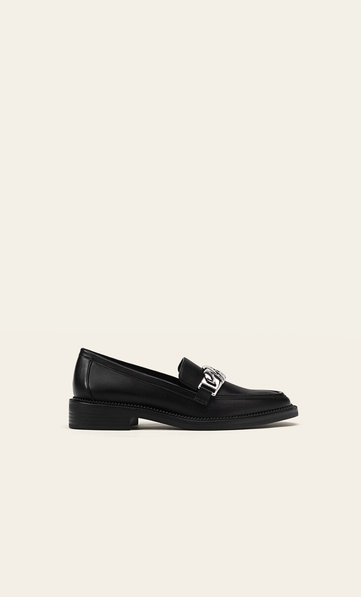 Black loafers with chain detail