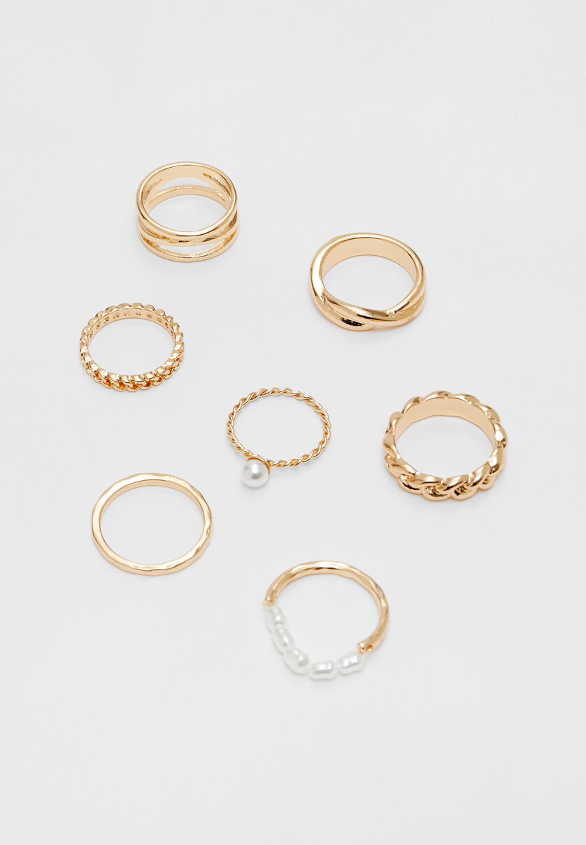 Set 7 anelli di perle finte con strass
