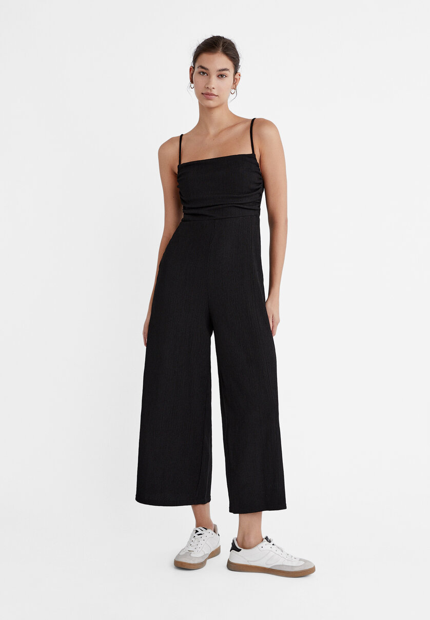 Cropped knit jumpsuit with draped neckline
