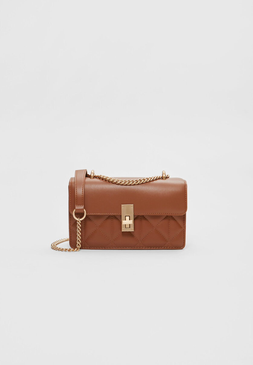 Crossbody bag with flap and closure