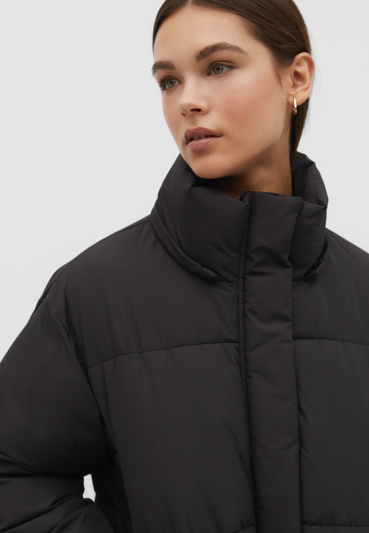 Asymmetrical puffer coat with fur clearance hood