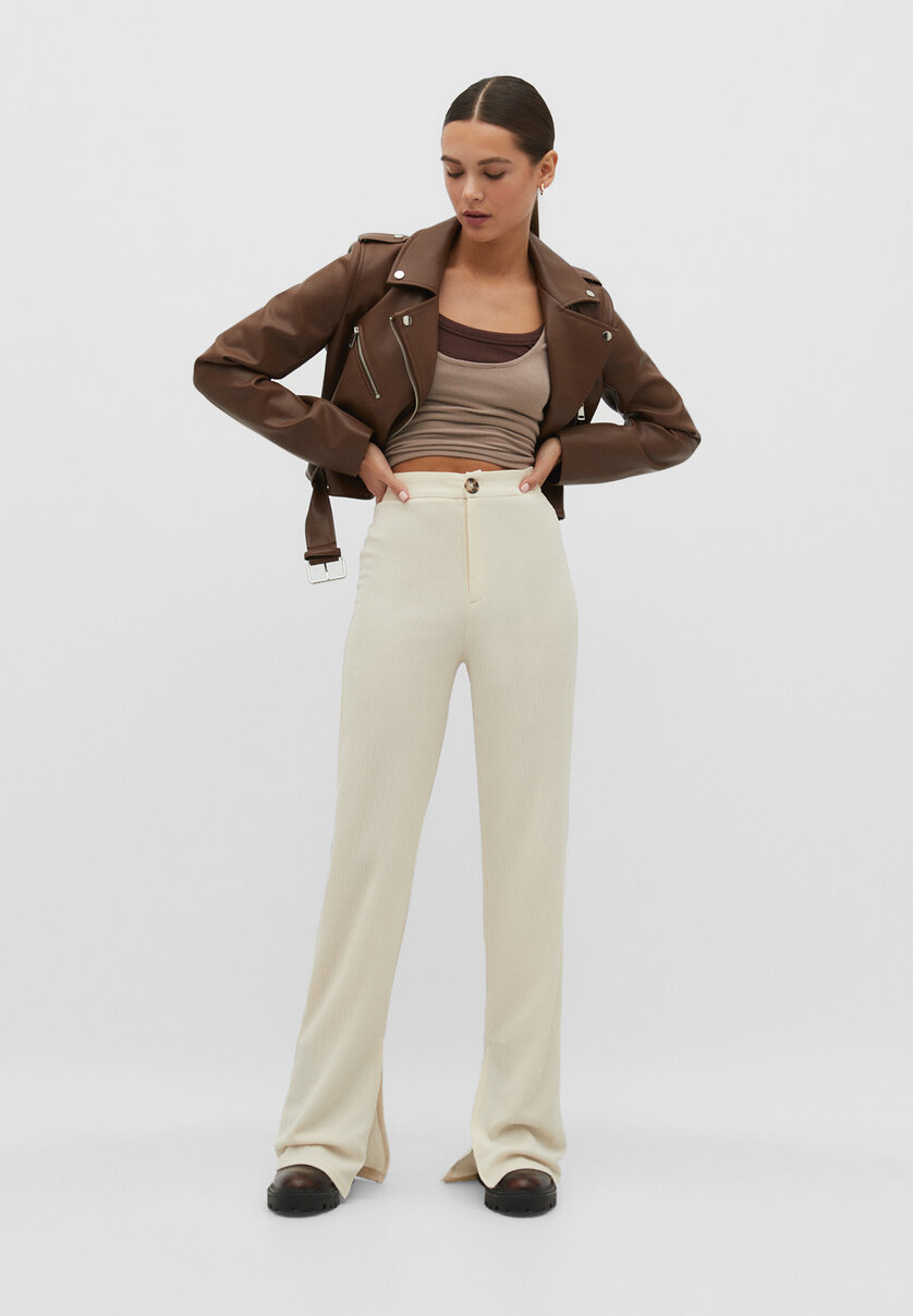 Rustic trousers with vent at the hem