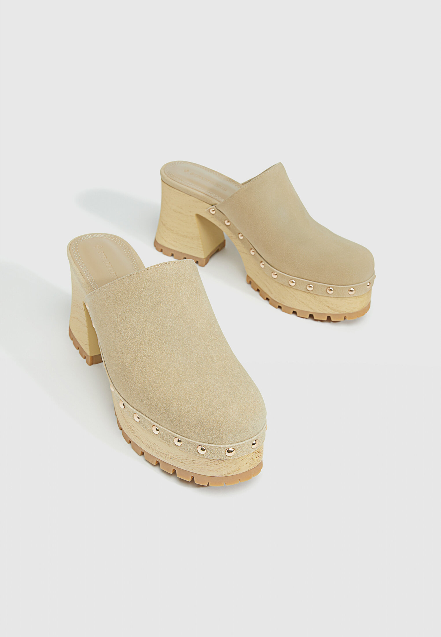 Heeled clogs with studs