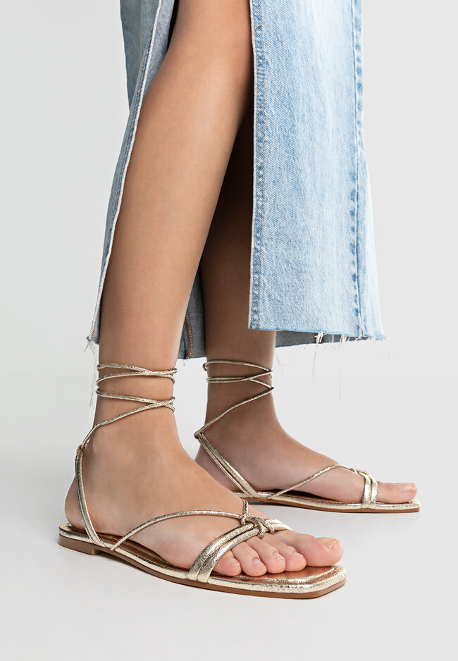 Gold t clearance strap sandals