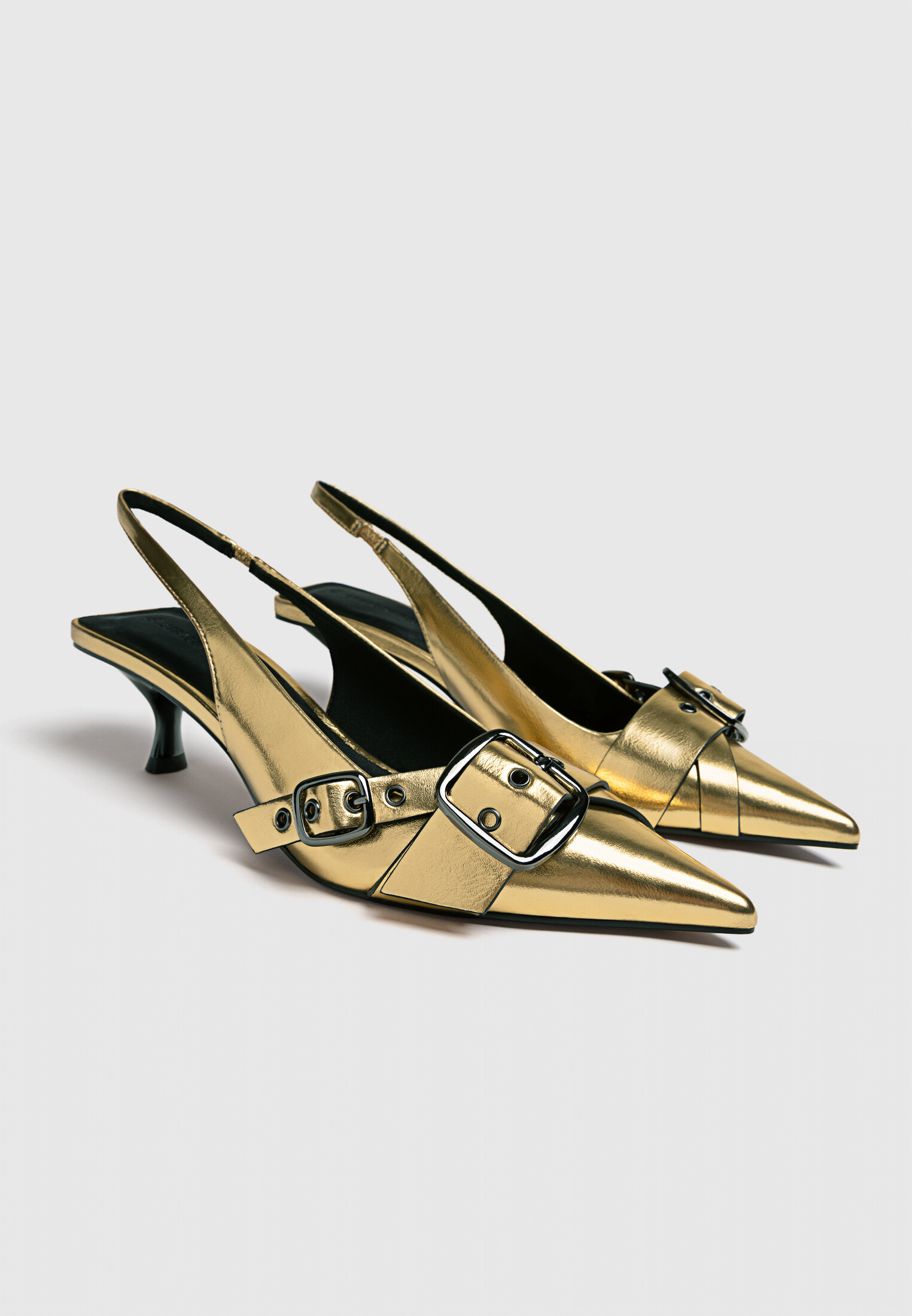 Gold heeled buckled shoes