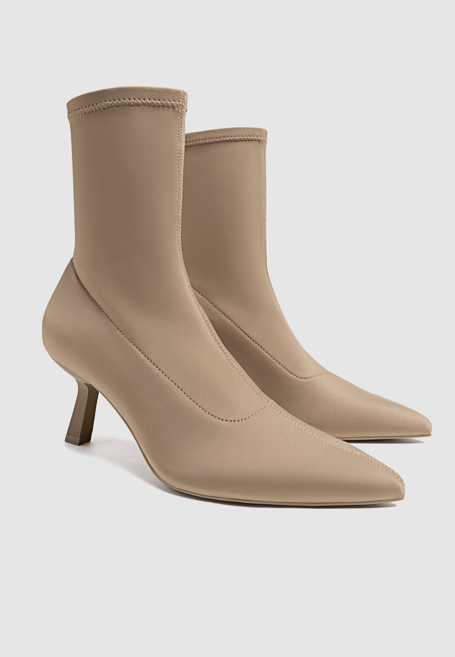 Stretch beige high heel ankle boots