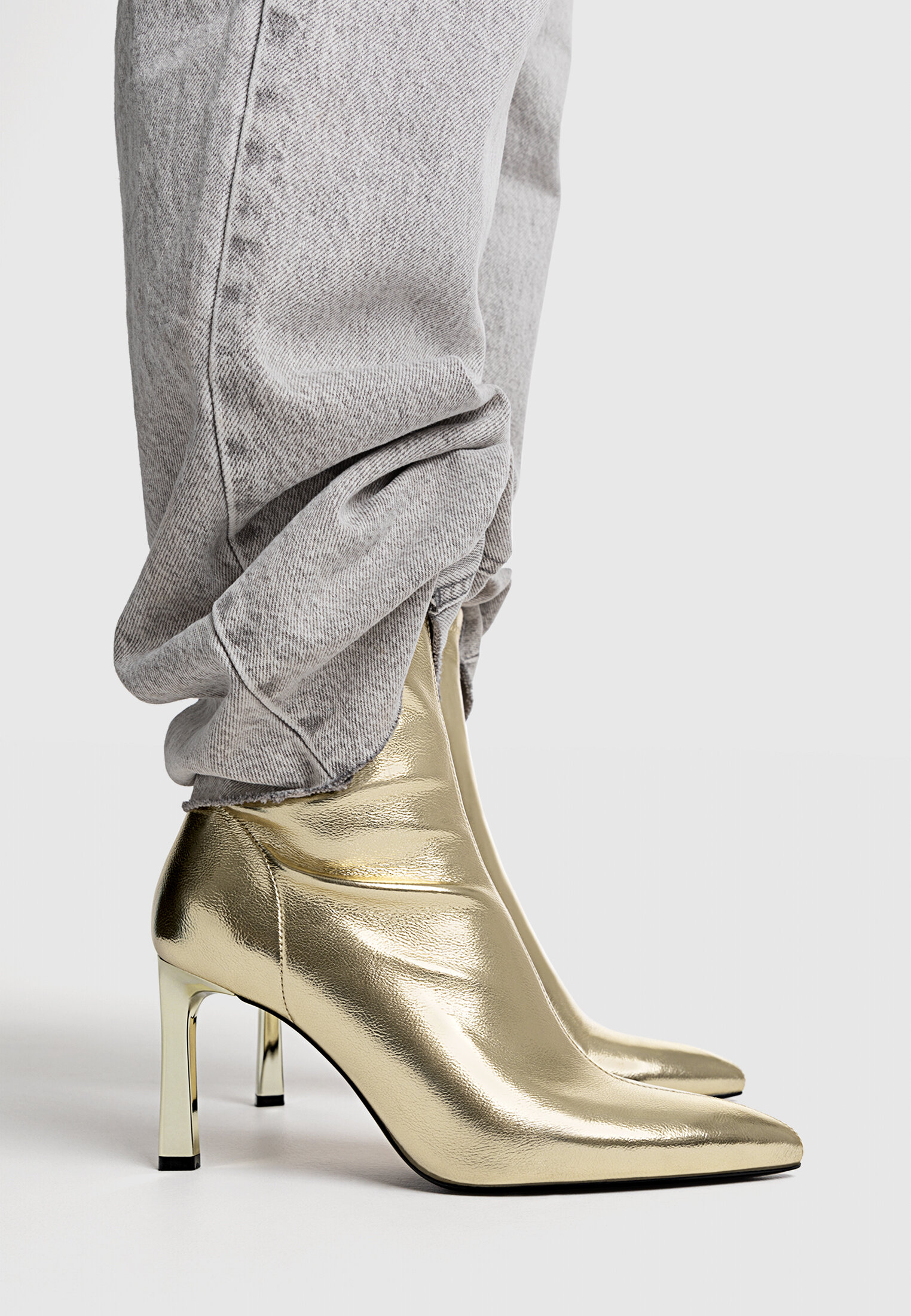 Stretch high heel gold ankle boots