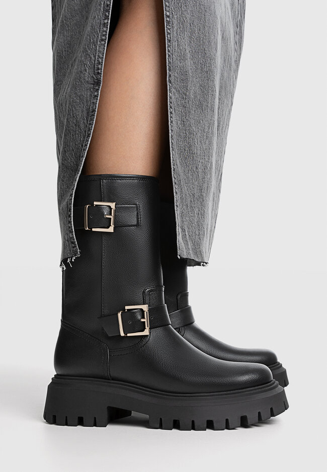 Black flat store boots with buckles