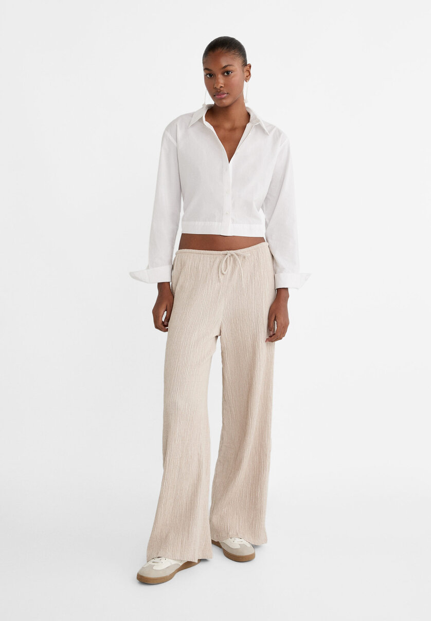 Crepe trousers with drawstrings - Women's fashion | Stradivarius 