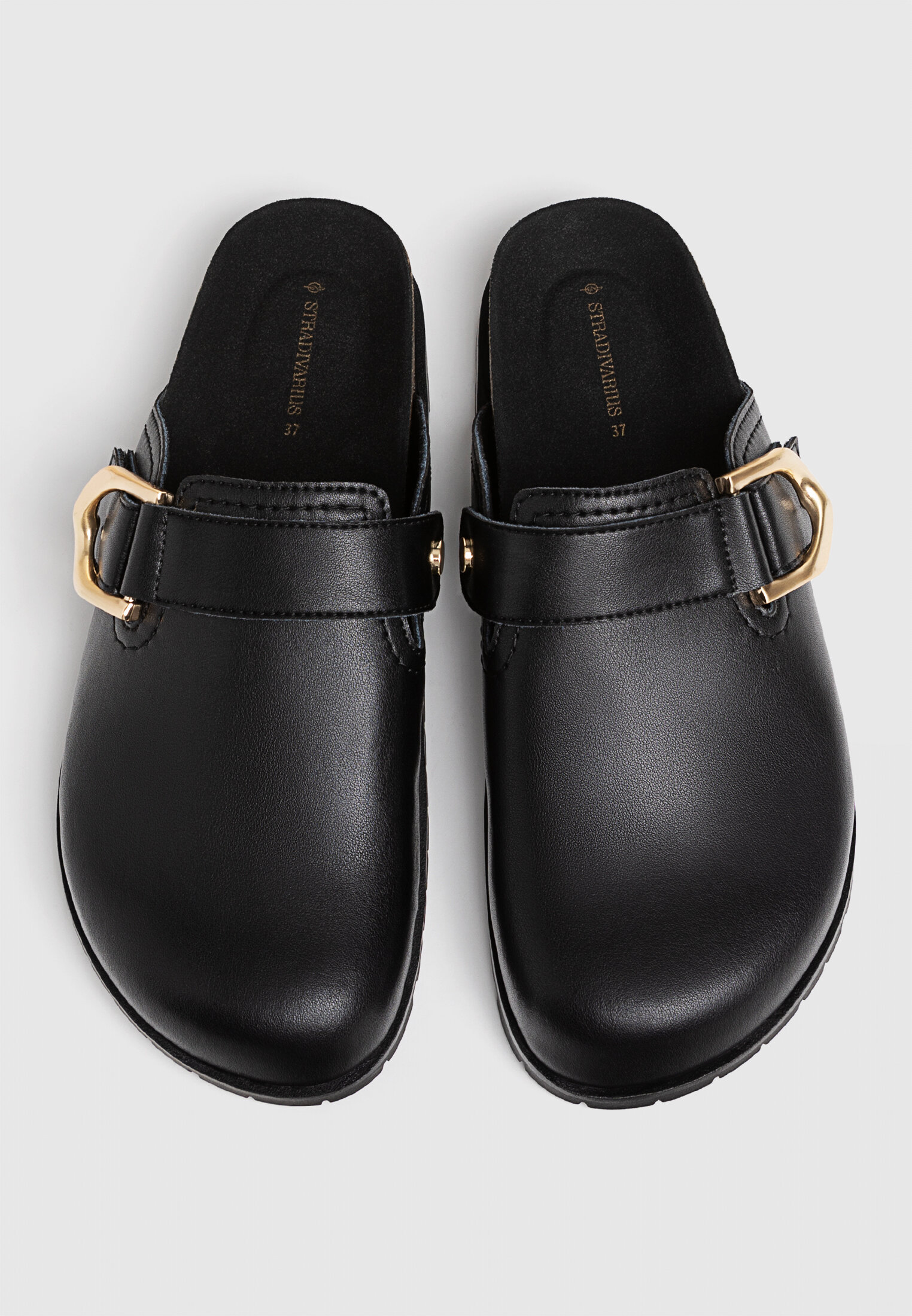 Black clogs with buckle clearance