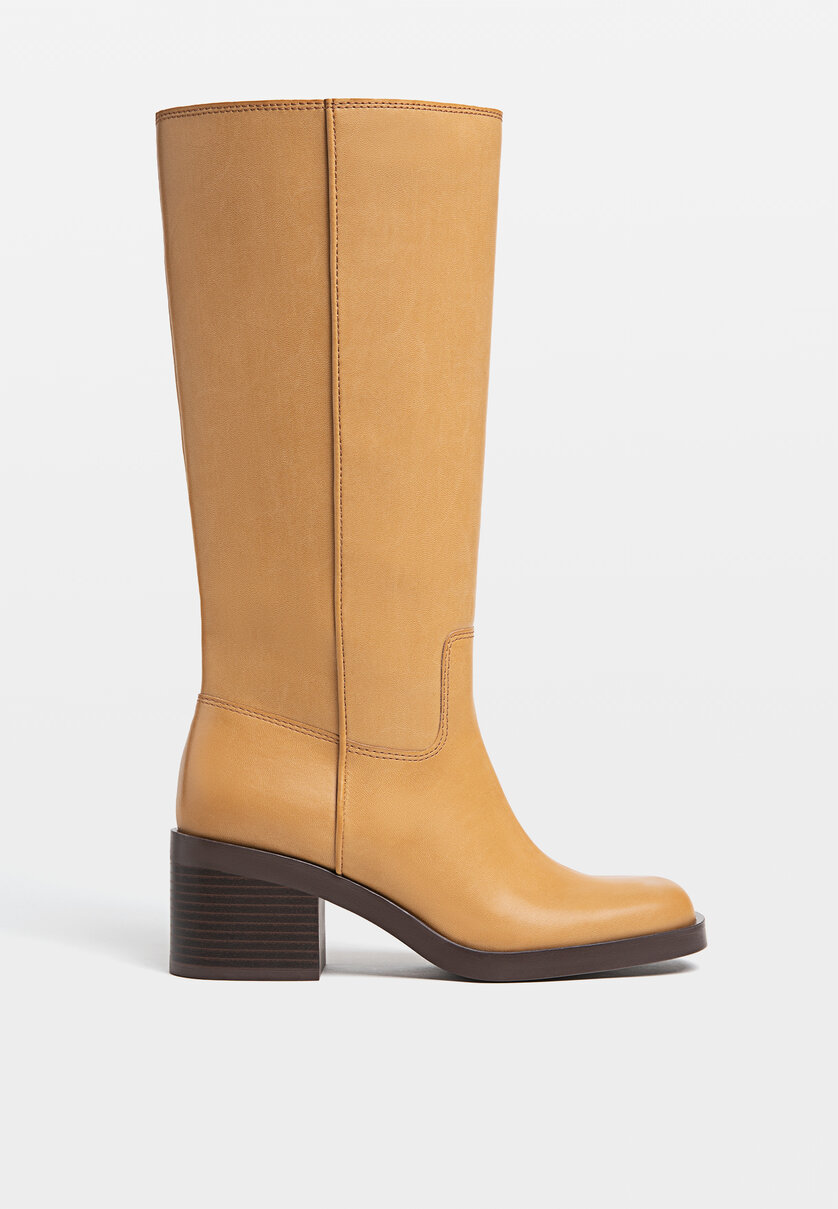 Heeled country-style knee-high boots