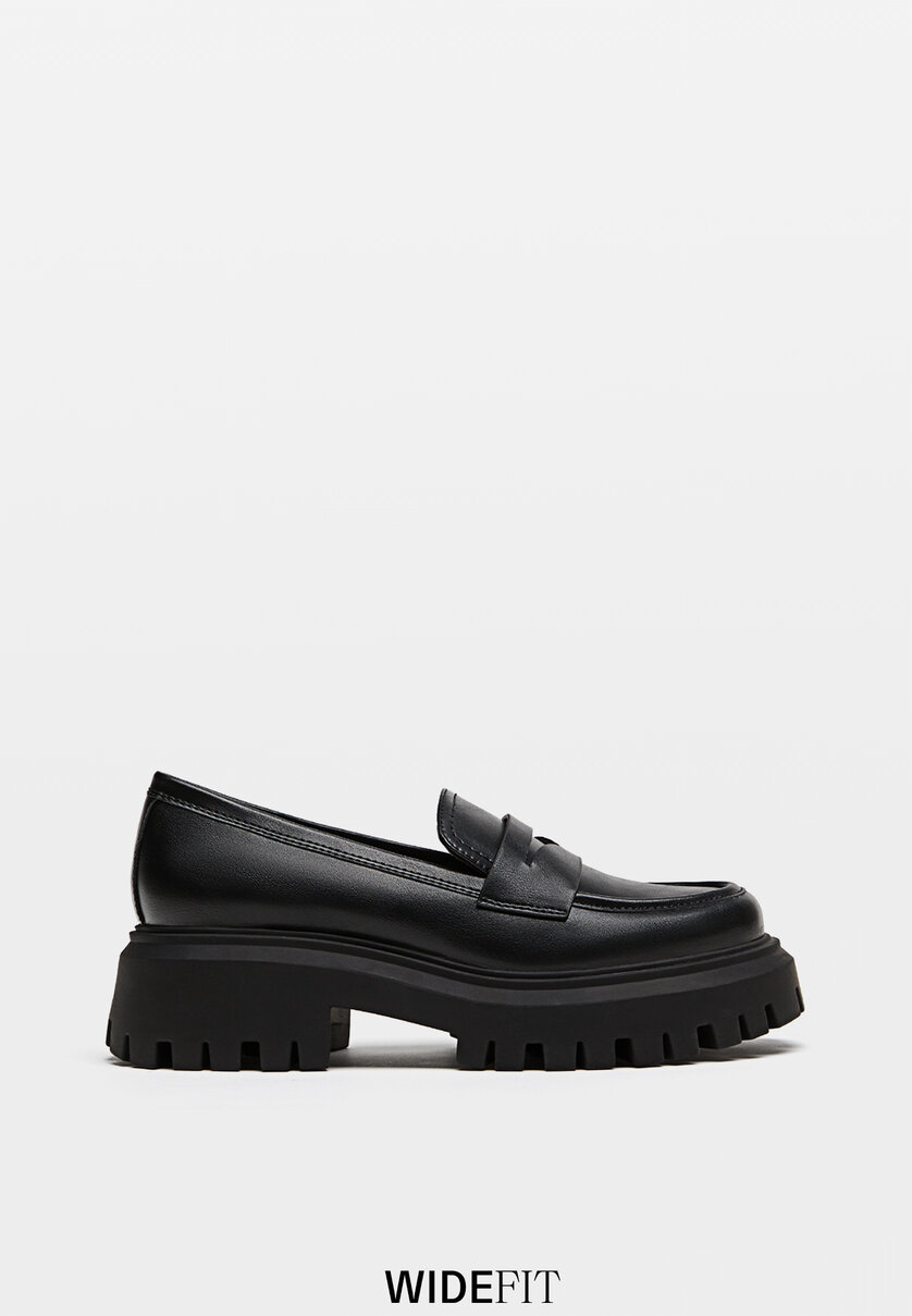 Black loafers with track soles