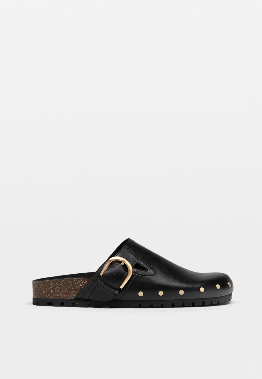 Black clogs with buckle details