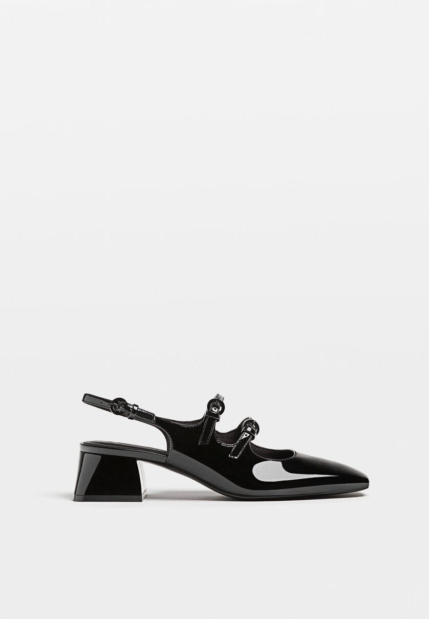 Black high-heel slingback ballerina-style shoes