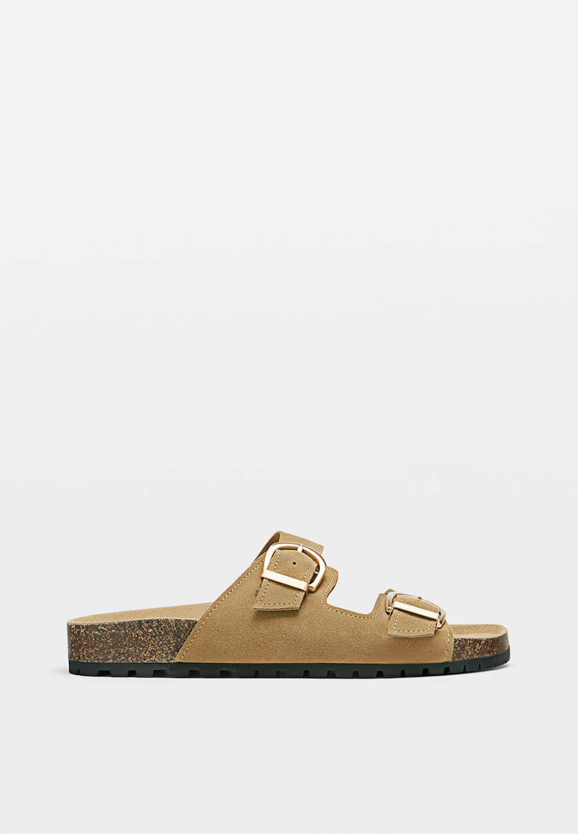 Flat leather sandals with buckles