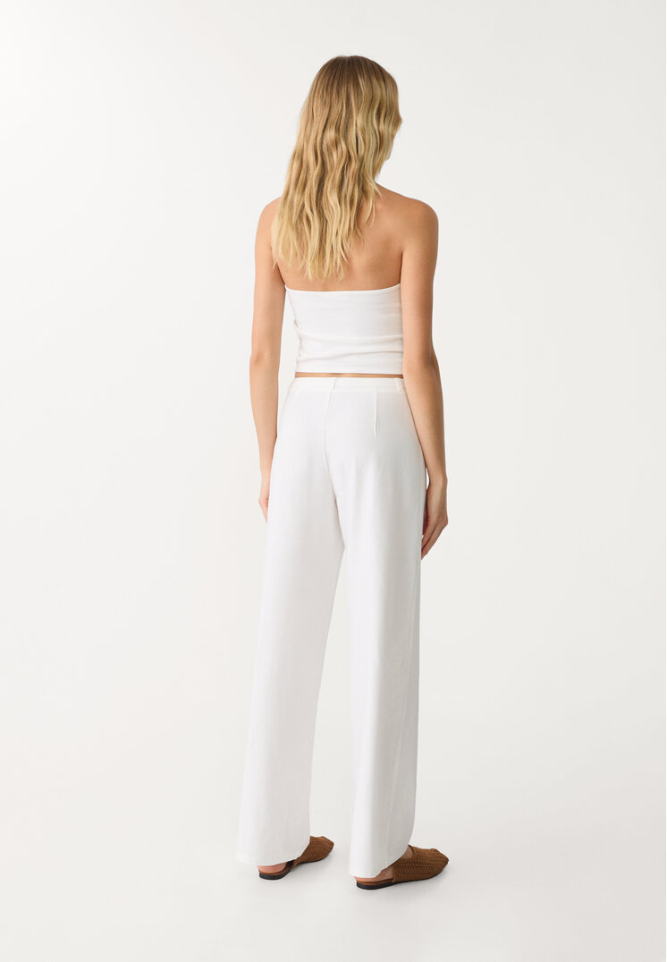 pantalon fluido bolsillos