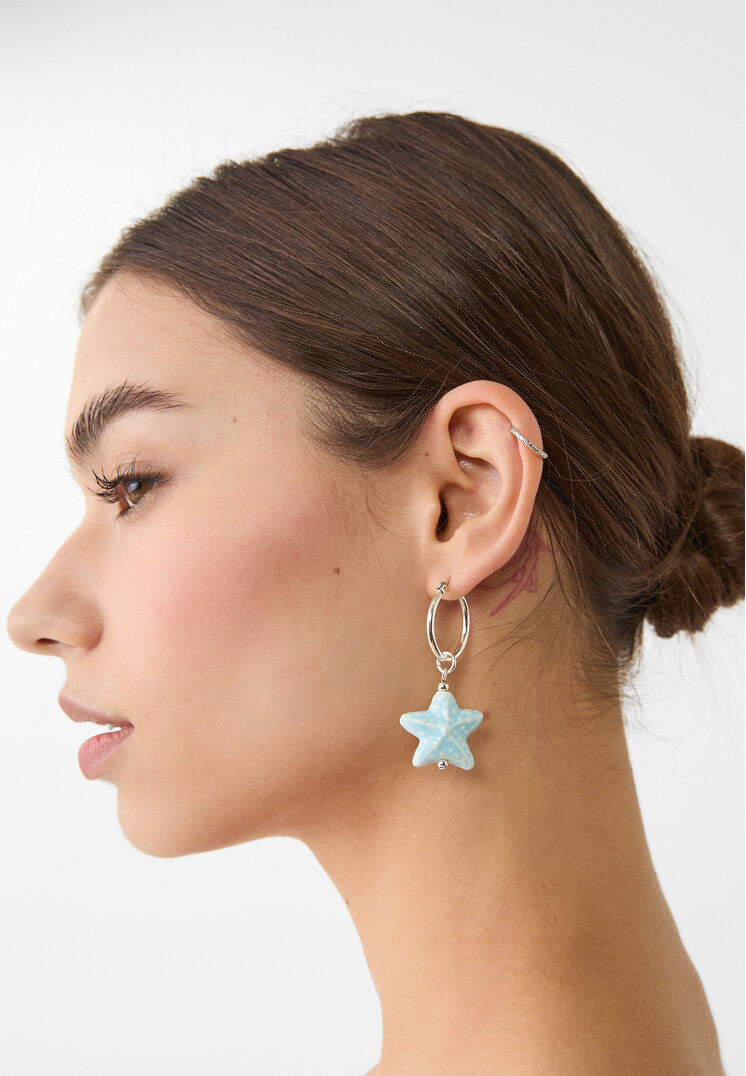set 2 pendientes estrella y pez